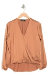 Renee C Satin Long Sleeve Surplice Top In Caramel