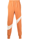 Nike Swoosh-print Fleece Track Pants In Orange