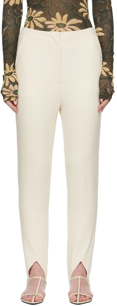 Nanushka Darby Jersey-crepe Tapered Stirrup Pants In Creme