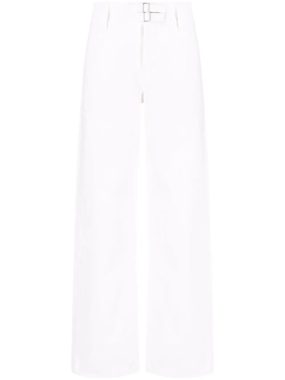 Jil Sander Washed Cotton Denim Flared Jeans In Cream