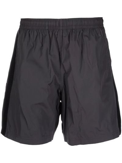 Alexander Mcqueen Selvedge Logo-jacquard Swim Shorts In Black