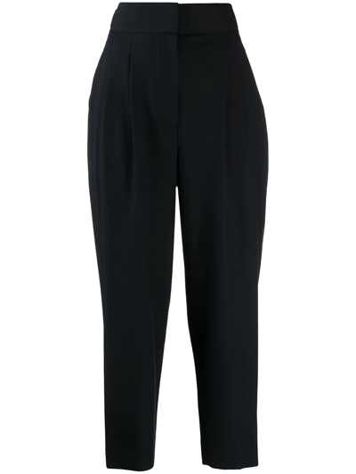 Goodious Pleated Tapered-leg Trousers In Schwarz