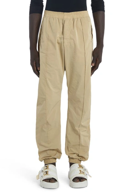 Bottega Veneta Washed Stretch Nylon Track Pants In Sesame