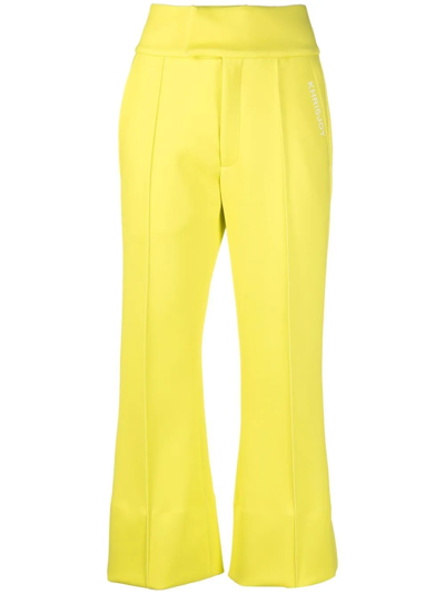 Khrisjoy Logo-print Cropped Flared Trousers In Yellow