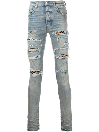 AMIRI MX1 DISTRESSED SKINNY JEANS