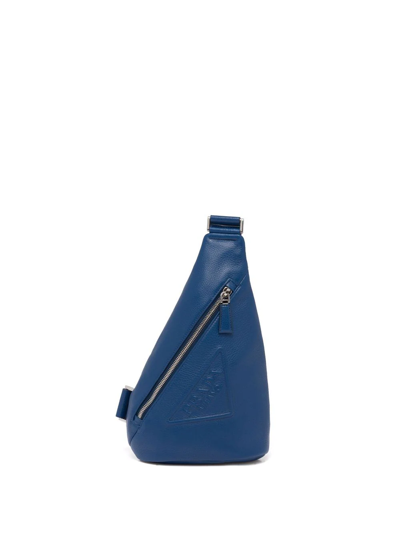Prada Logo-embossed Cross Backpack In Blau