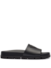 Prada 38 Logo Strap Lug-sole Leather Slides In Schwarz