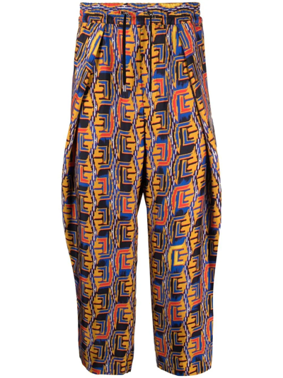 Balmain Graphic-print Cropped Trousers In Blau