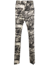 Amiri Graphic-print Flared Trousers In Nude