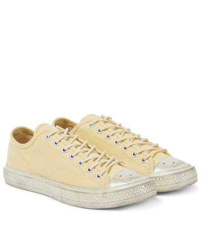 Acne Studios Distressed Organic Cotton-canvas Sneakers In Pale Yellow/off White