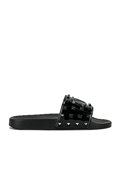 Valentino Garavani Vlogo Rockstud 平底拖鞋 In Black