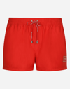 DOLCE & GABBANA SHORT SWIM TRUNKS WITH BRANDED PLATE