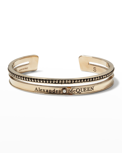 Alexander Mcqueen Twin Skull Bracelet In Brass