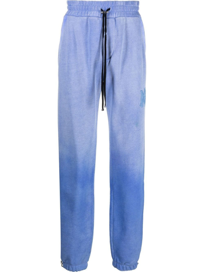 Amiri Slim-fit Tapered Logo-embroidered Cotton-jersey Sweatpants In Blue
