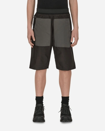 Arnar Mar Jonsson Hraun Contrast-pocket Relaxed Fit Shell Shorts In Black