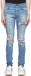 Amiri Mx1 Skinny-fit Panelled Distressed Jeans In 70's Indigo-12 oz It