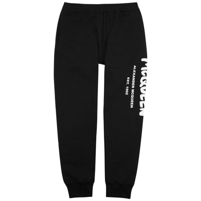Alexander Mcqueen Tapered Logo-print Loopback Cotton-jersey Sweatpants In Black