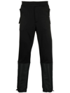 Alexander Mcqueen Panelled Tapered Track Pants In Black
