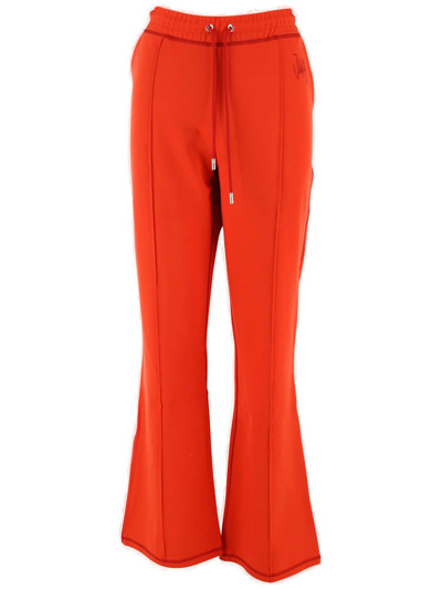 Jw Anderson Logo-embroidered Flared Track Pants In Red