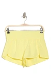 Z By Zella Interval Woven Run Shorts In Yellow Elfin