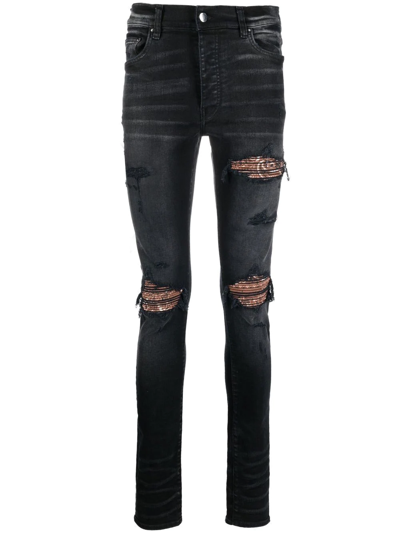 Amiri Ripped Skinny-fit Jeans In Black