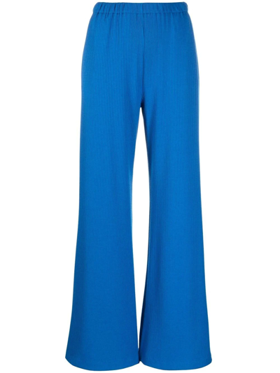 Merci Ribbed-knit Flared Trousers In Blue
