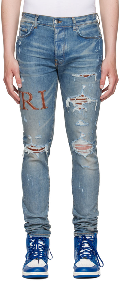 Amiri Skinny-fit Leather-trimmed Distressed Jeans In Clay Indigo