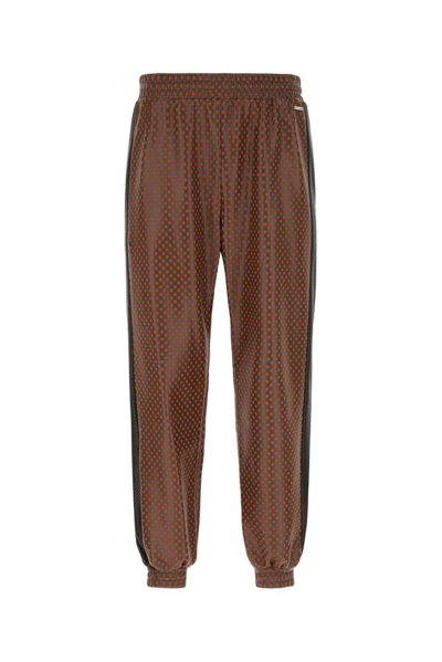 Koché Logo Plaque Tapered Jogger Trousers In Brown