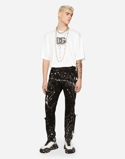 Dolce & Gabbana Skinny Stretch Jeans With Rips And Splash Design In Combined Colour