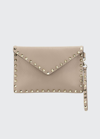 Valentino Garavani Rockstud Envelope Flap Wristlet Pouch In Beige