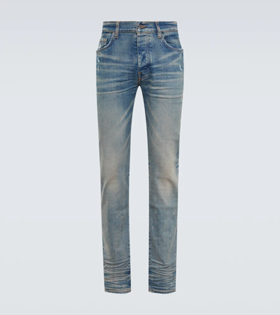 Amiri Stack Light Washed Whiskering Skinny Jeans In Blue