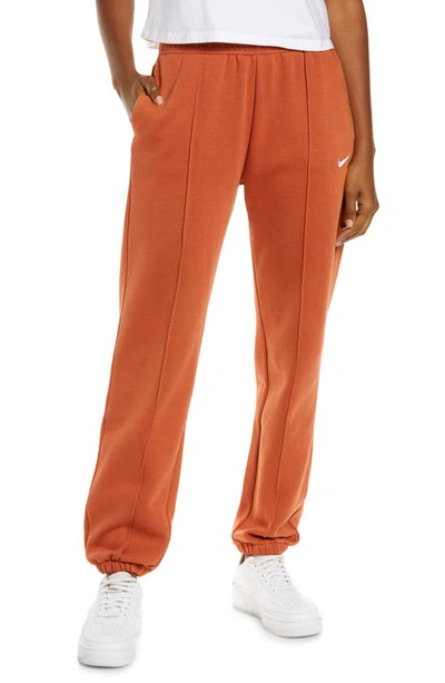 Nike Sportswear Essential Fleece Pants In Burnt Sunrise/ White