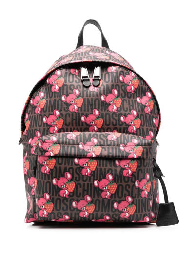 Moschino Allover Graphic Printed Zipped Backpack In Brown