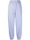 MCQ BY ALEXANDER MCQUEEN WOMAN LIGHT BLUE JOGGERS WITH LOGO