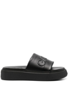 Ganni Logo-embossed Vegan Leather Platform Slides In Schwarz