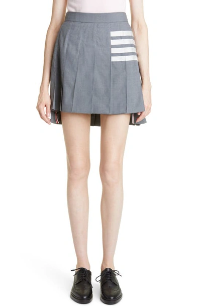 THOM BROWNE DROP BACK PLEATED WOOL MINISKIRT