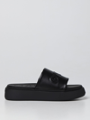 Ganni Logo-embossed Vegan Leather Platform Slides In Black