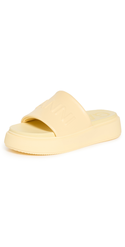 Ganni Yellow Logo Embossed Faux Leather Slides In 321 - Pale Banana