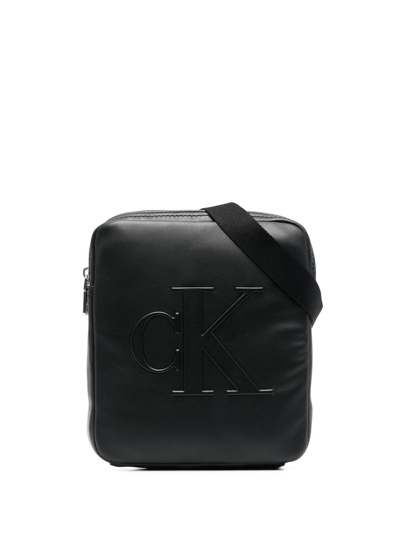 Calvin Klein Debossed-logo Faux-leather Messenger Bag In Black