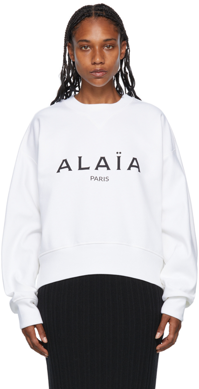 Alaïa Long Sleeve Round Neck Logo Print Sweatshirt In White