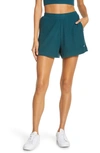 Alo Yoga Muse Ribbed Shorts In Galactic Teal