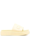 Ganni Yellow Logo Embossed Faux Leather Slides In Yellow