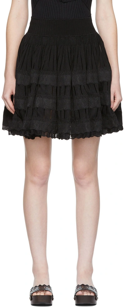 ALAÏA BLACK FLUID MINISKIRT