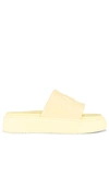 Ganni Yellow Logo Embossed Faux Leather Slides In Yellow
