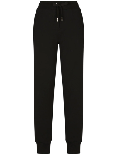 Dolce & Gabbana Logo-embossed Cotton Track Pants In Black