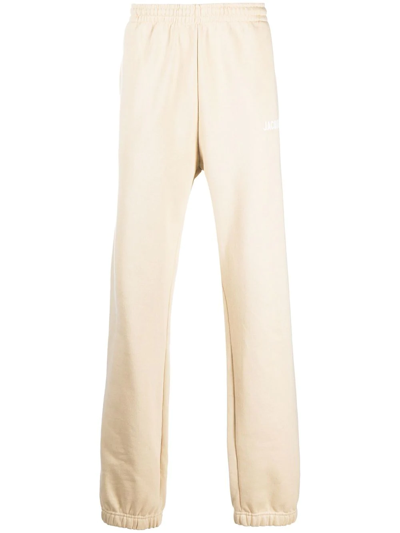 Jacquemus Logo-print Organic Cotton-jersey Track Pants In Beige
