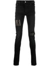 Amiri Old English Logo Distressed Denim Jeans In Black