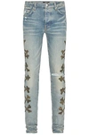 Amiri Bones-detail Slim-cut Jeans In Clay Indigo
