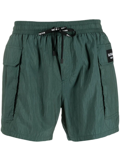 Balmain Logo-patch Drawstring Swim Shorts In Grün