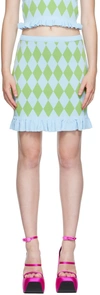 Pushbutton Diamond Pattern Mini Skirt In Bl*gn
